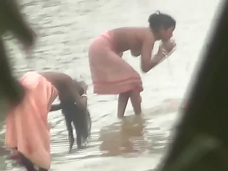 Indian women bathing wits the river